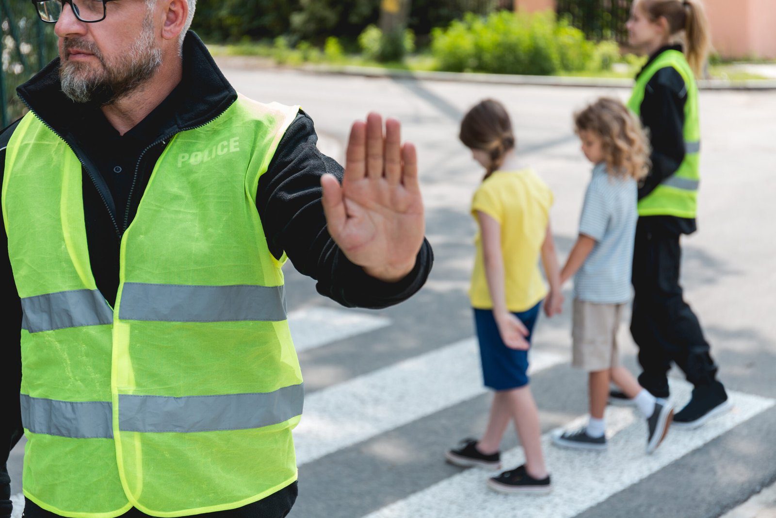 Child crossing a marked school crosswalk during school hours.