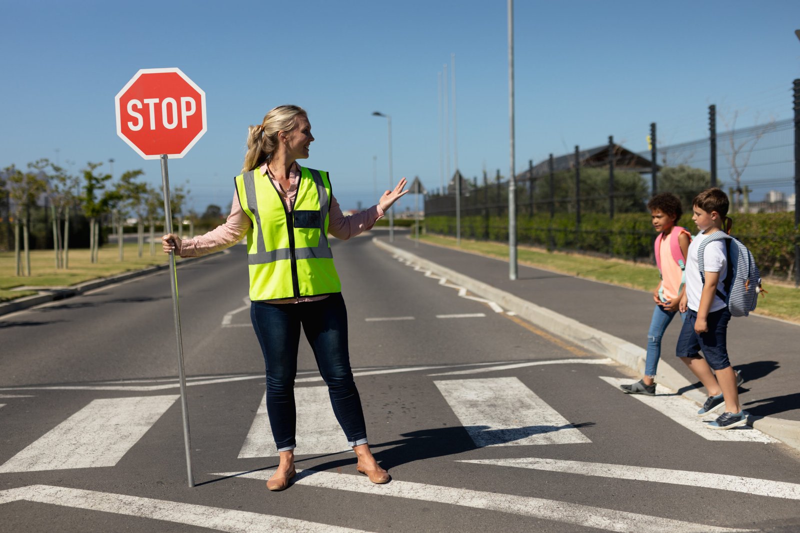 Child crossing a marked school crosswalk during school hours.